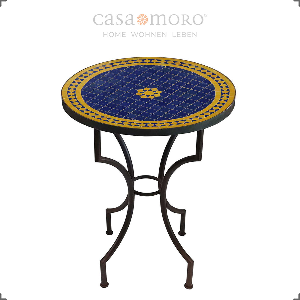 Mosaic table as a dining table for two with a star-shaped zellige pattern in blue and yellow