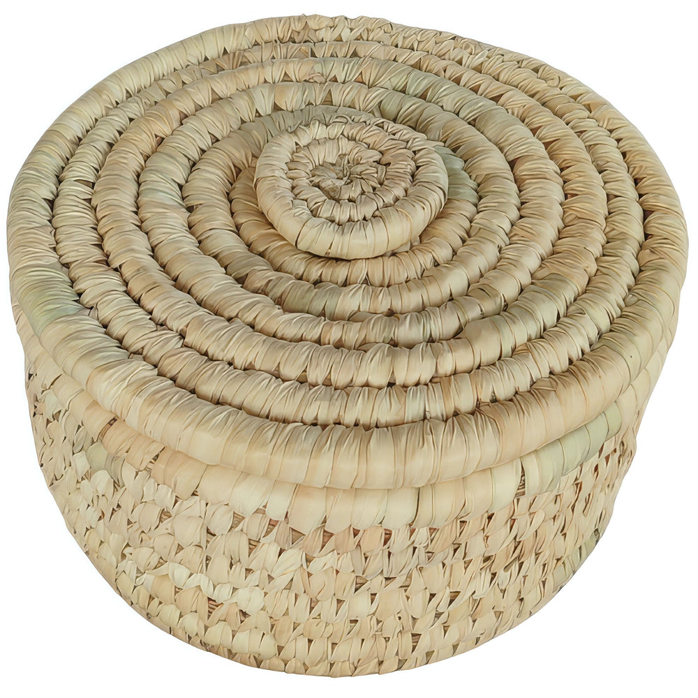 Small round palm leaf basket with closed lid, spiral weave and pale beige and straw tones.