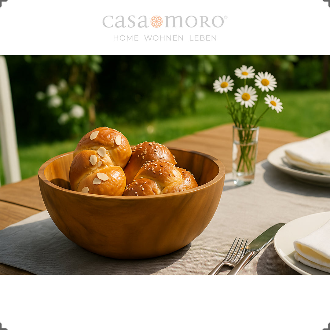 Compact teak bowl as a bread basket in the garden ambience