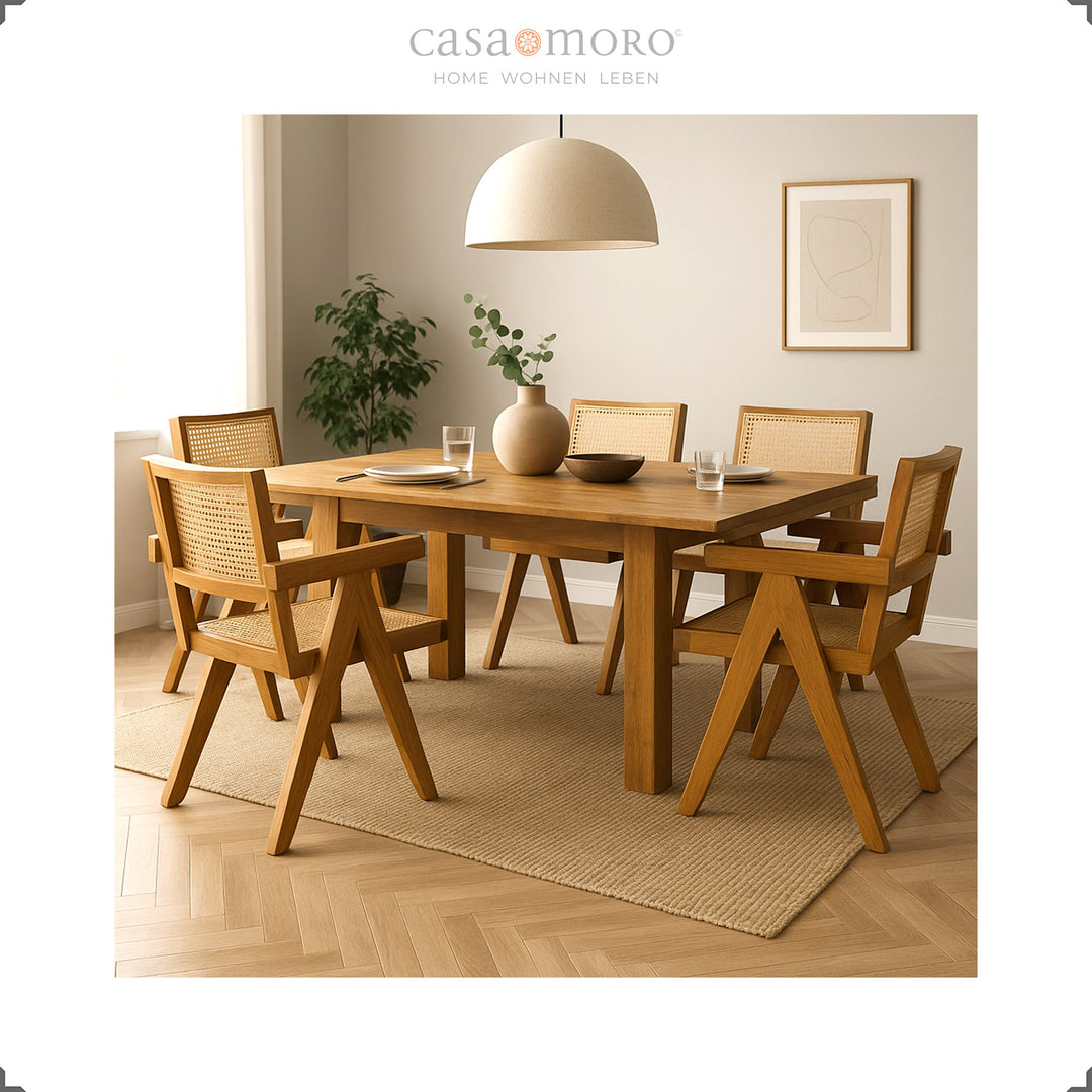 Dining room with teak table and armchairs with Viennese wicker, harmonious interior in natural tones