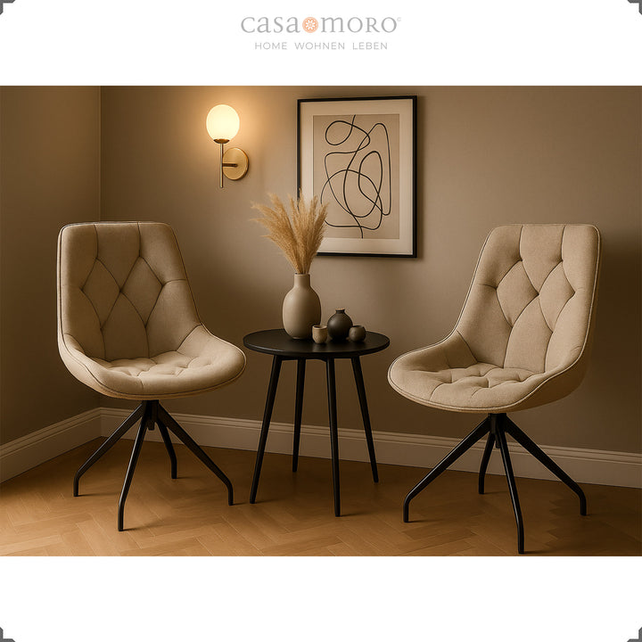 Two upholstered chairs that can be rotated 360° in brown with a black metal frame - modern seating area with side table, mural and soft lighting