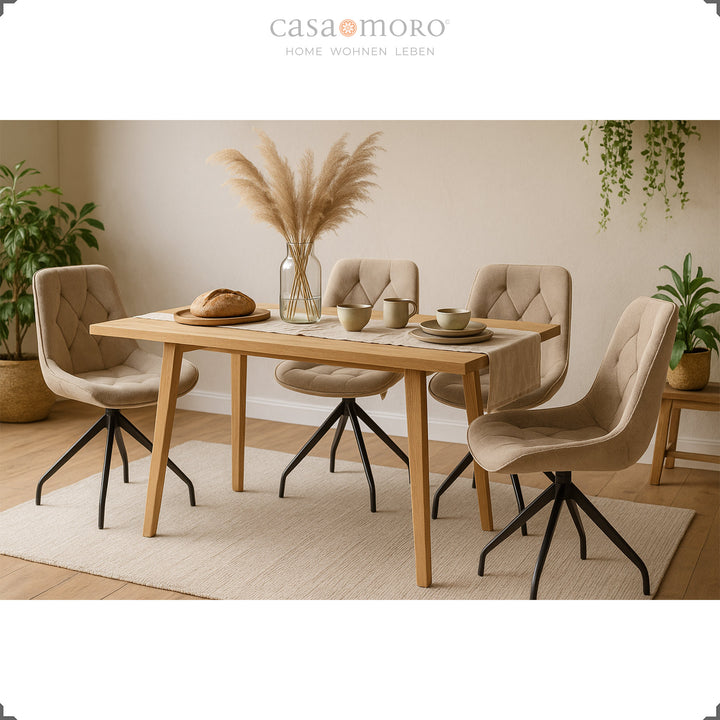 Four upholstered chairs can be rotated 360° in brown with a black metal frame - stylish dining area with wooden table, pampas grass and a natural living atmosphere