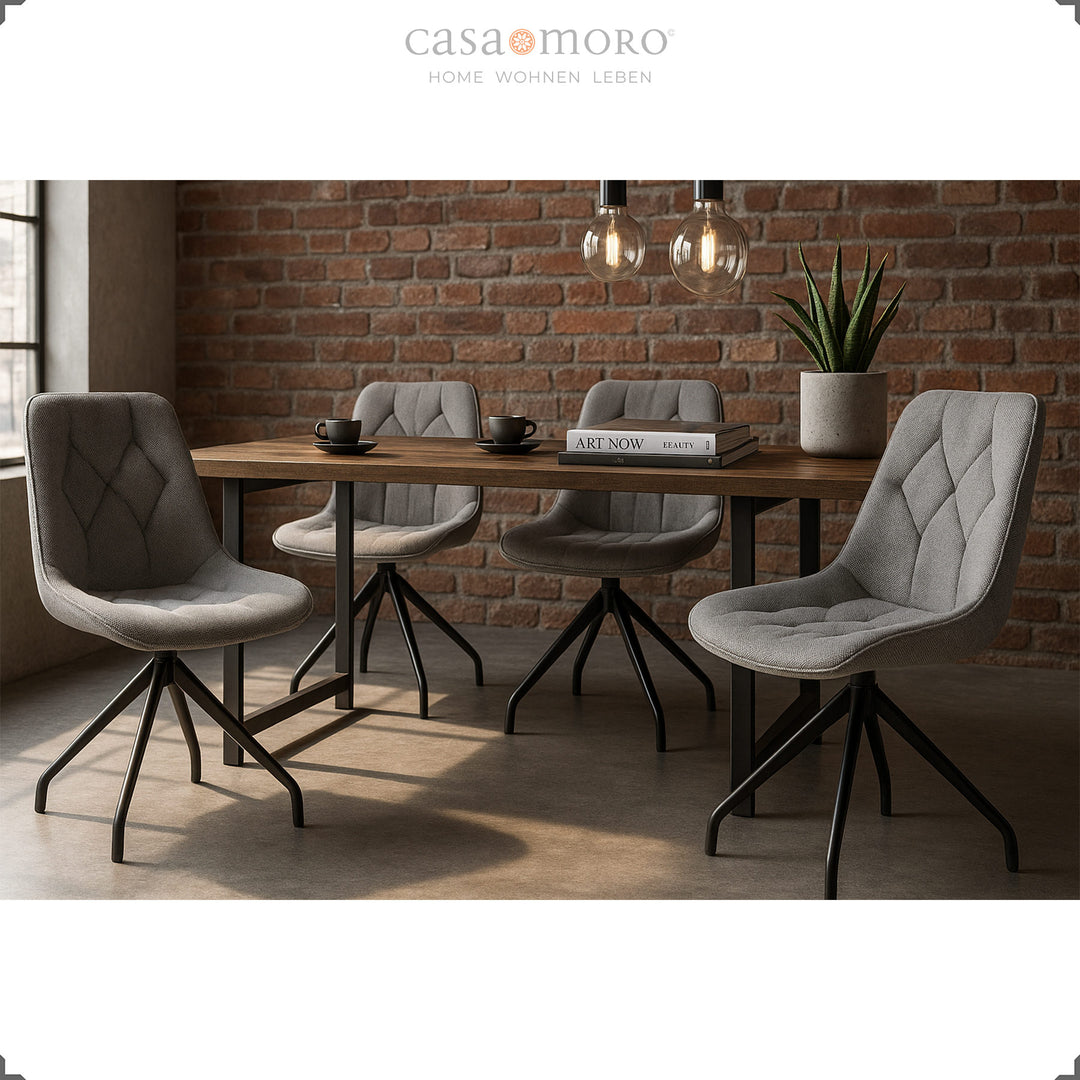 Four gray dining chairs with 360° swivel function and black metal frame - modern dining area with wooden table and industrial loft character