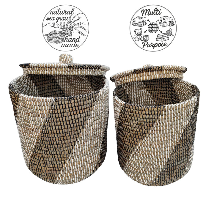 Open natural/black/white seagrass baskets with raised lids and symbols for handmade work and storage.