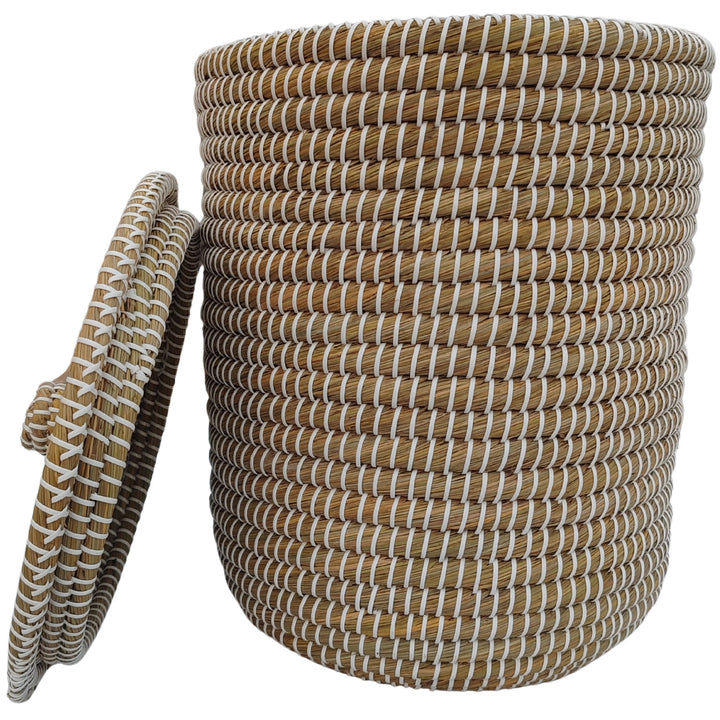 Round woven natural/white seagrass basket, approximately 40 litres, with lid leaning to the side.