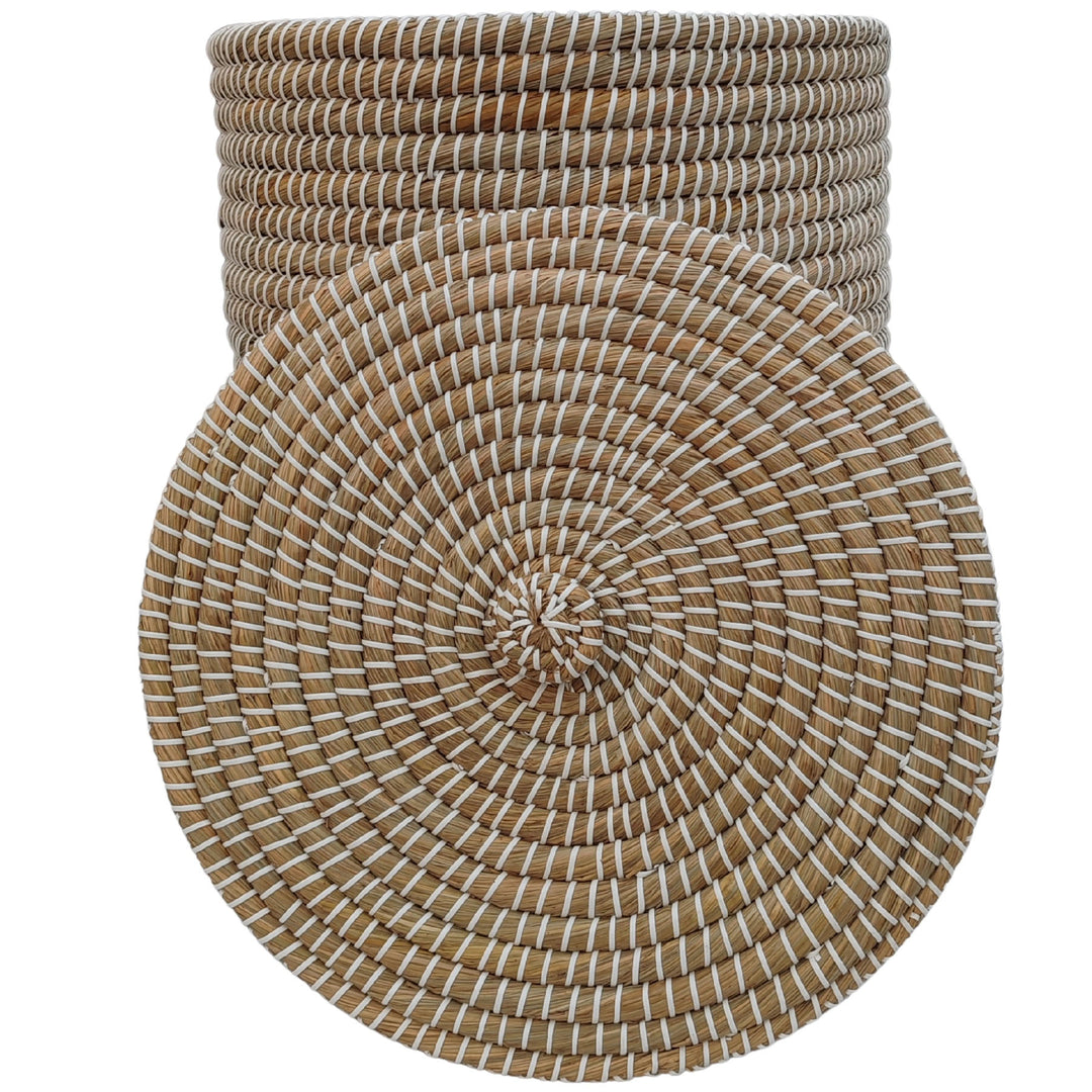 Natural/white seagrass woven basket with a capacity of approximately 65 liters and a visible underside when the lid is removed.