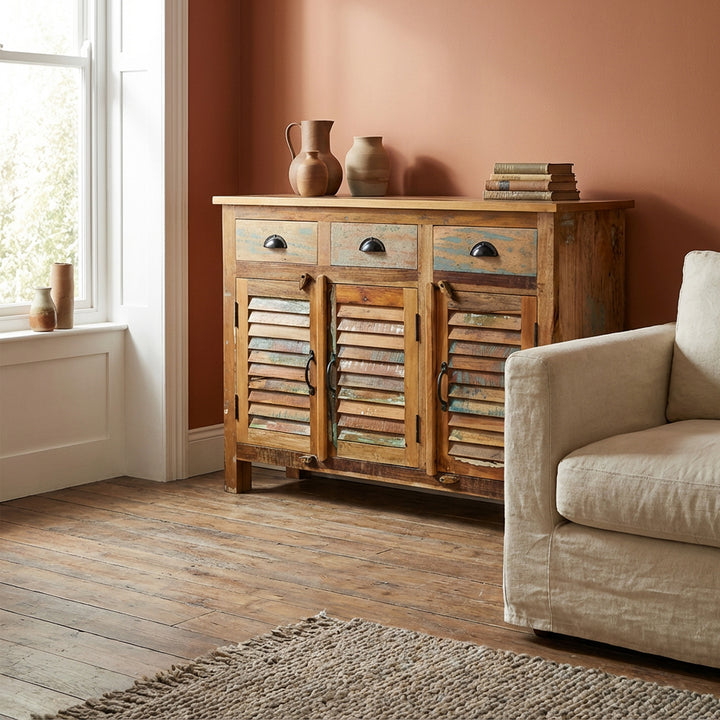 Highboard made of solid wood and reclaimed wood with drawers in a vintage country house style, placed in the living room