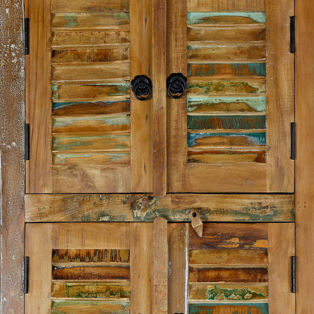Detailed view of a tall cabinet made of solid wood and reclaimed wood in vintage style