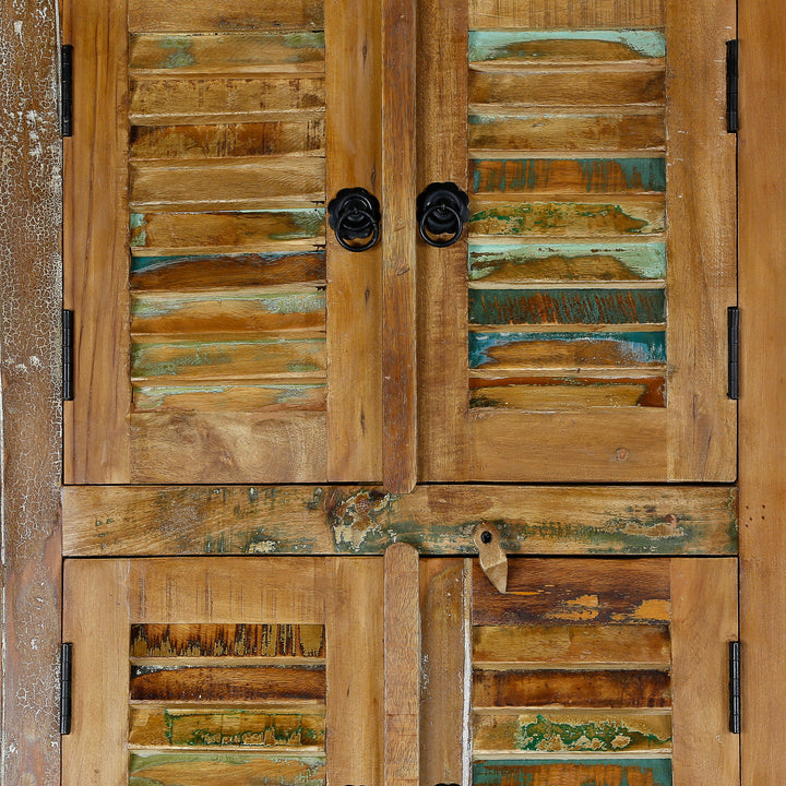 Detailed view of a tall cabinet made of solid wood and reclaimed wood in vintage style