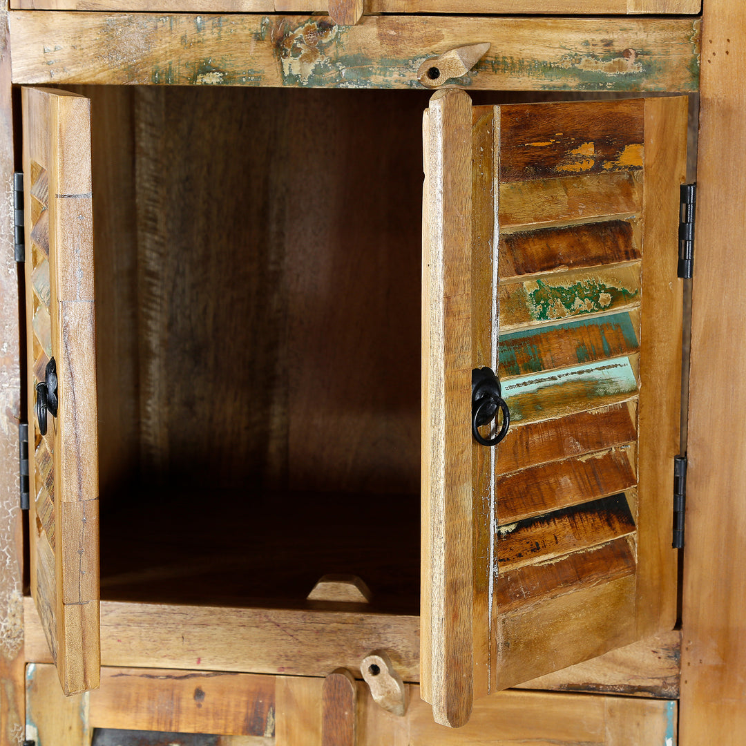 Detailed view of a narrow cabinet made of solid old wood in a vintage look