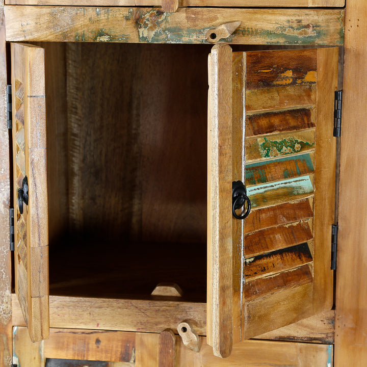 Detailed view of a narrow cabinet made of solid old wood in a vintage look
