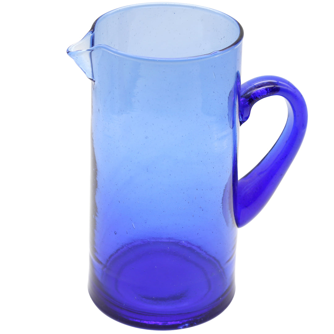 Blue carafe made of hand-blown glass with a curved handle