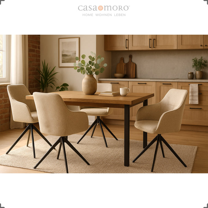 Four 360° swivel upholstered chairs with beige armrests at a wooden table in a bright kitchen with warm wood tones and natural decoration