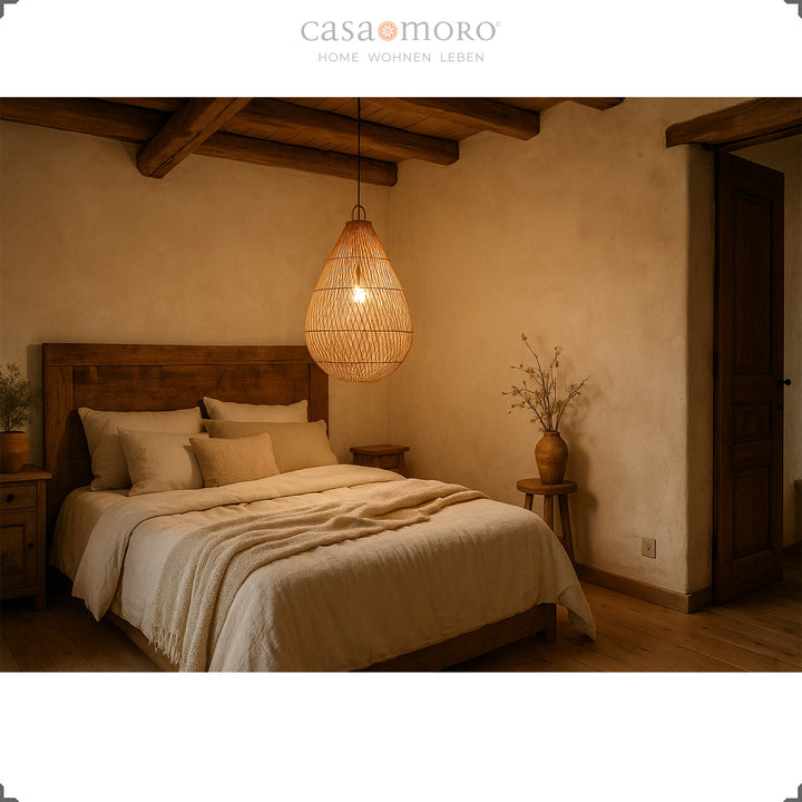 Rattan lamp in teardrop shape as a ceiling light in the bedroom, provides warm light and ensures comfort