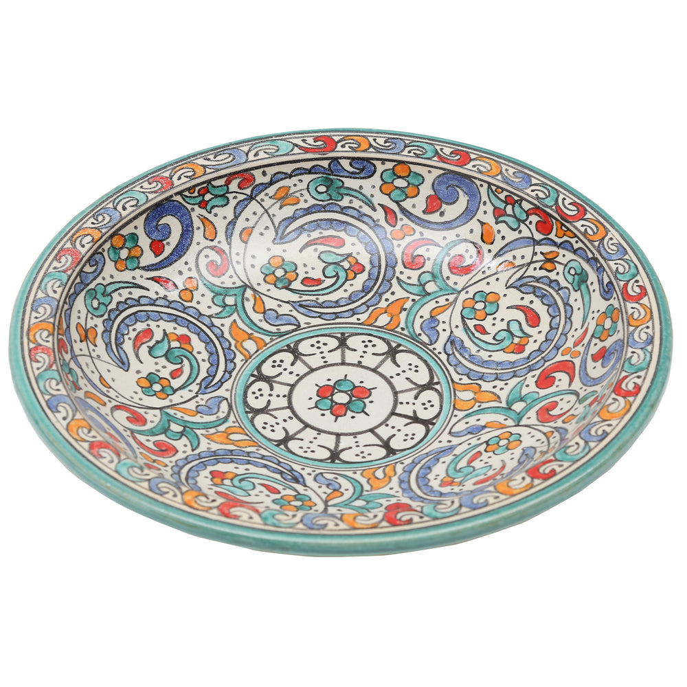 Large Moroccan ceramic bowl with a turquoise rim and floral design