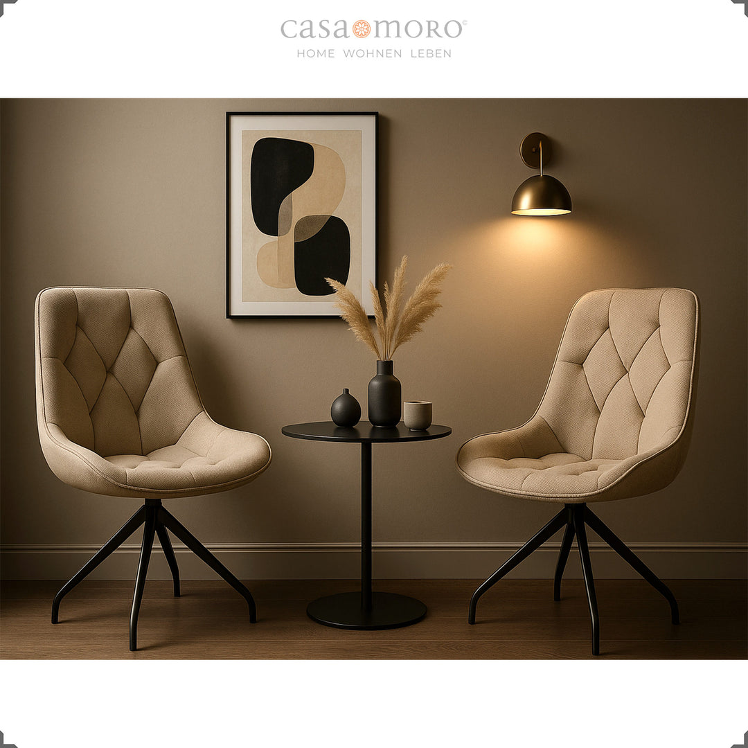 Two upholstered chairs can be rotated 360° in brown with a black metal frame - stylish seating area with side table and wall picture in a modern living environment