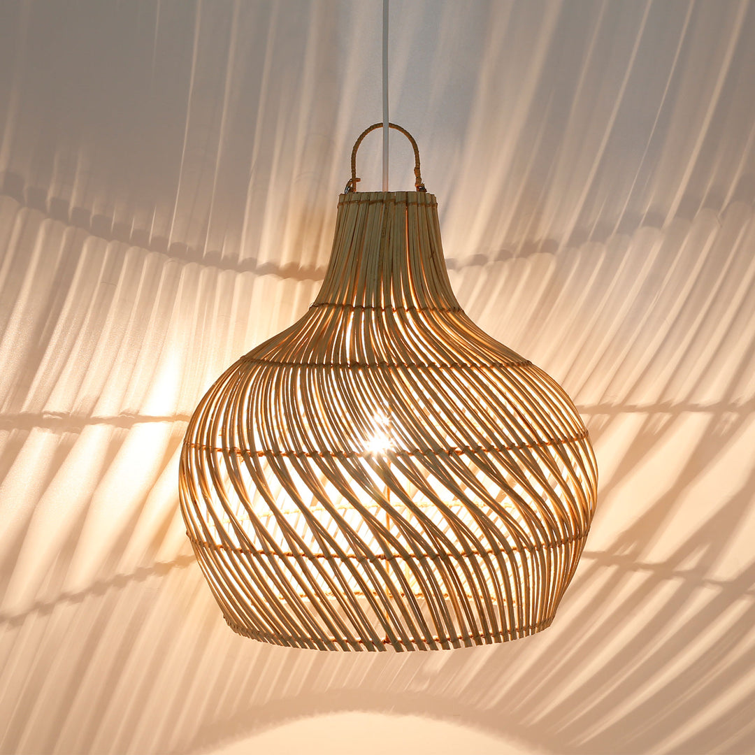 Handcrafted rattan ceiling lamp with elegant, curved weave and warm play of light on the wall and ceiling