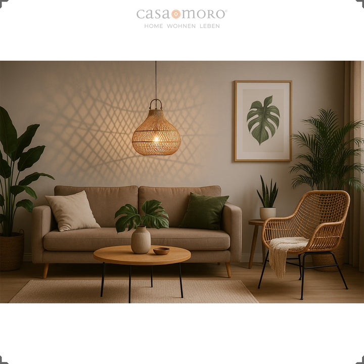 Hanging rattan lamp above sofa in living room with warm light and natural decoration
