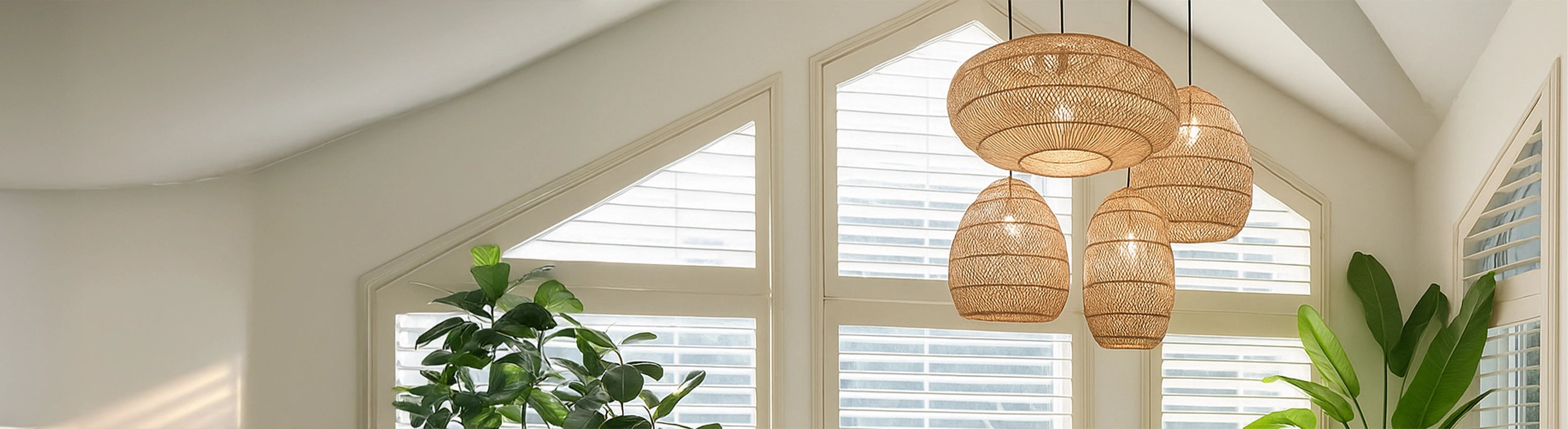 rattan lamps – Braided rattan lamps in different shapes, as hanging lights in the living room with plants and daylight