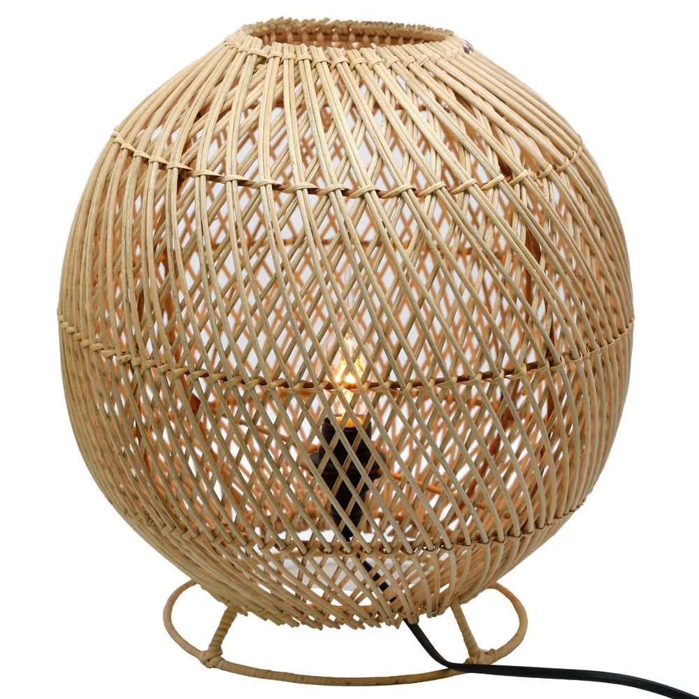Round table lamp made of natural rattan with a fine woven pattern and visible light bulb