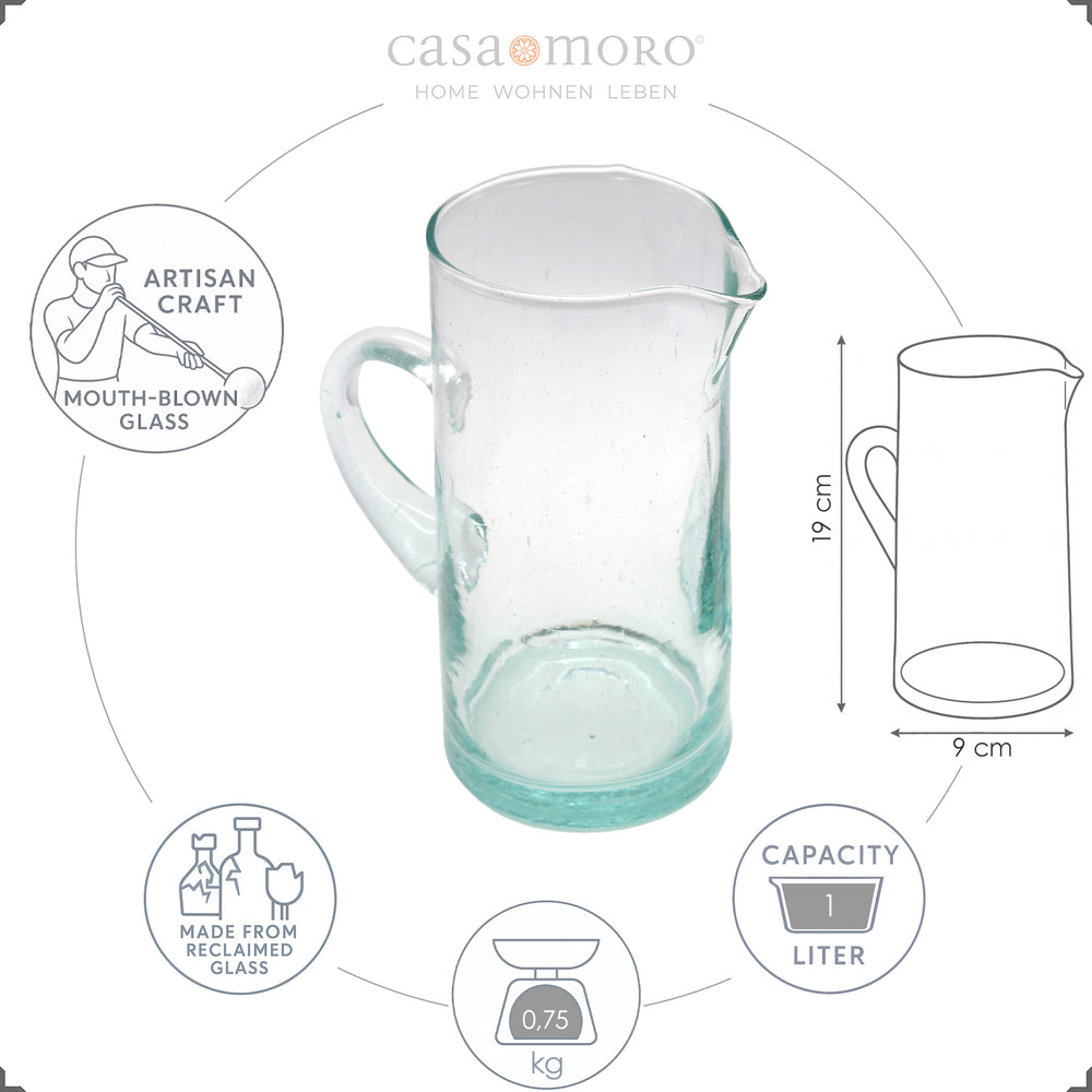 Carafe with fruit juice and ice - made from clear, hand-blown glass