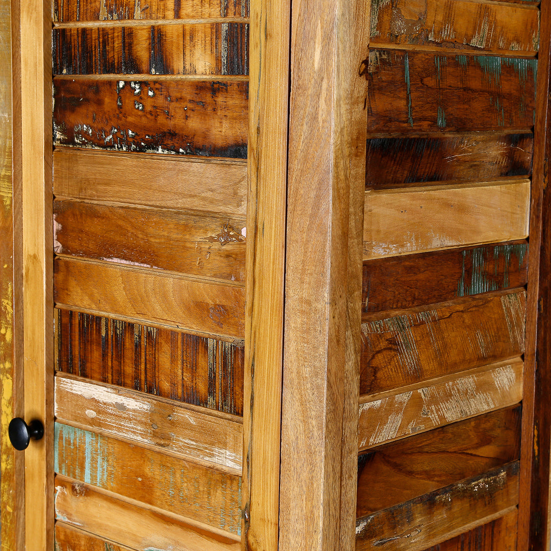 Detailed view of a narrow cabinet made of solid wood and reclaimed wood in vintage style