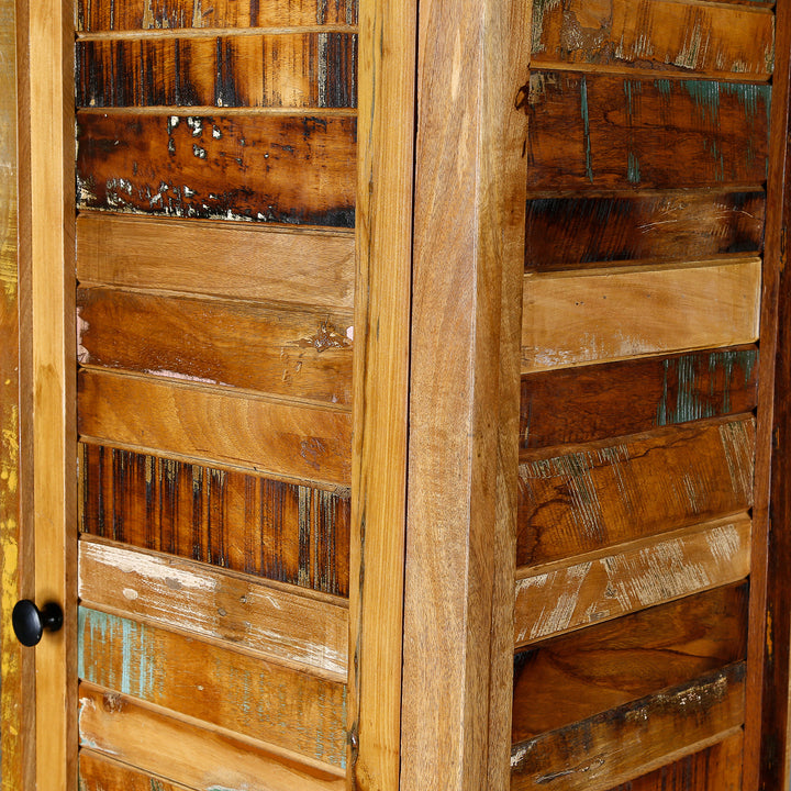 Detailed view of a narrow cabinet made of solid wood and reclaimed wood in vintage style