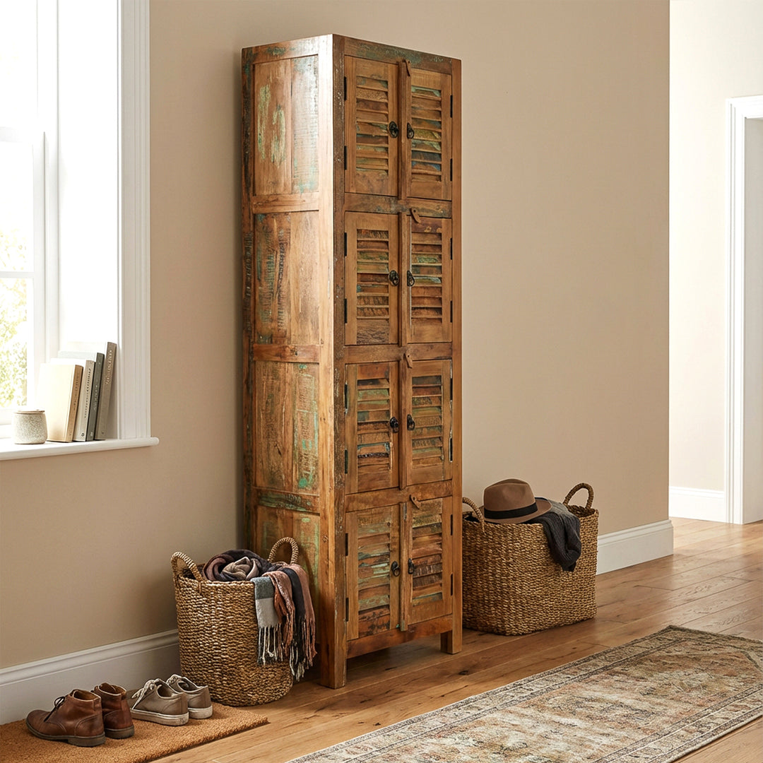 Narrow cabinet made of solid wood and reclaimed wood in vintage style, placed in the hallway