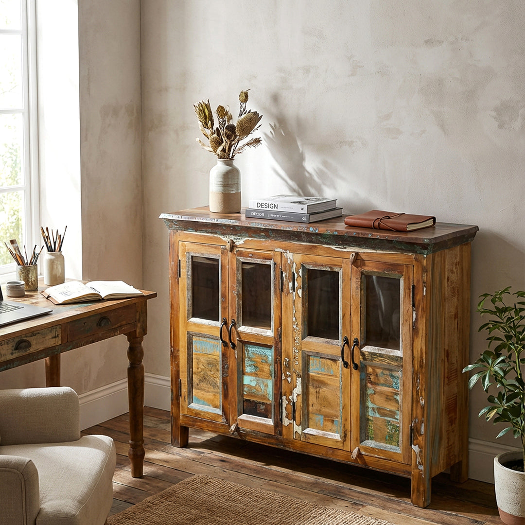Vintage sideboard made of solid reclaimed wood with glass doors in the living room as stylish storage