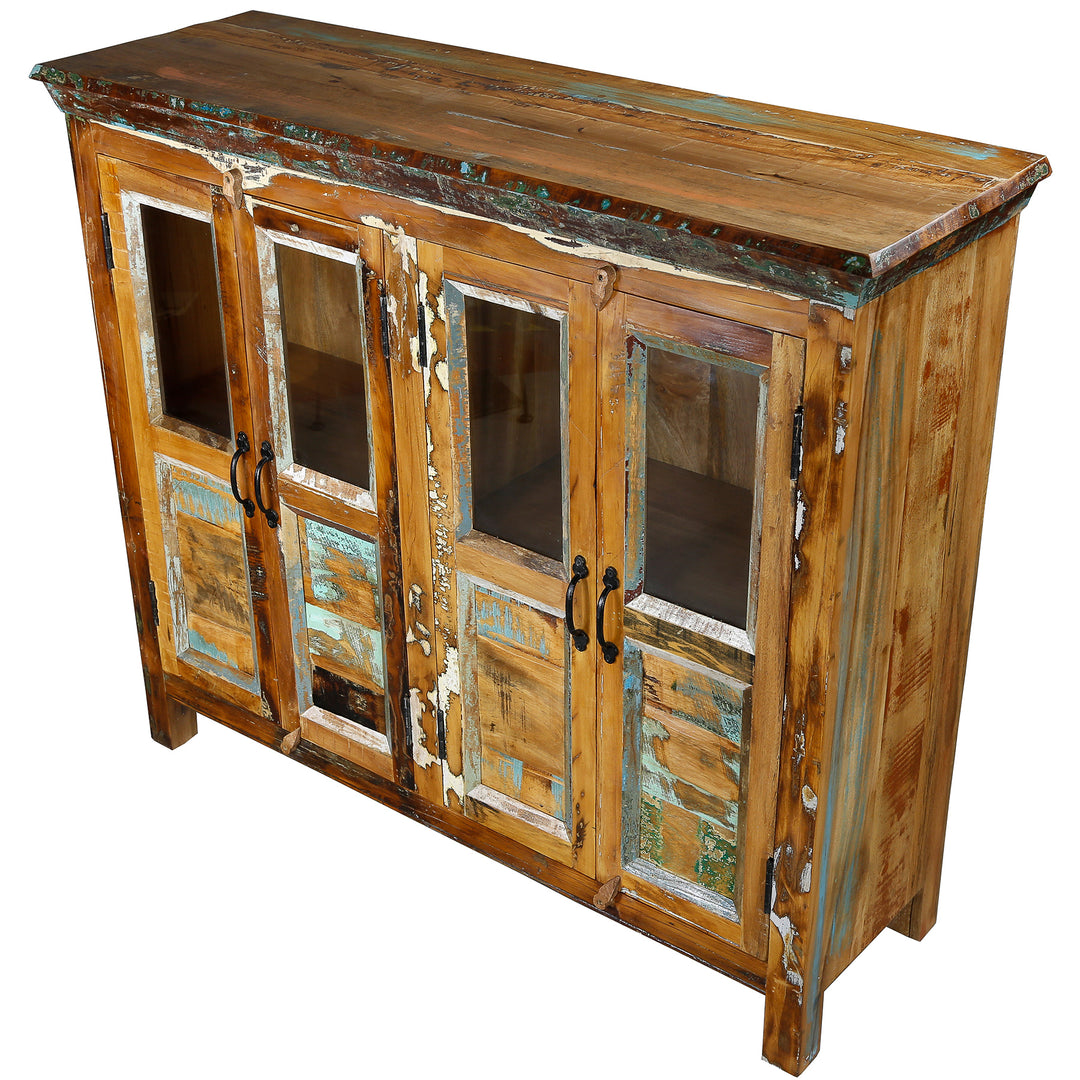 Sideboard made of old solid wood with glass doors and patchwork front, isolated on a white background