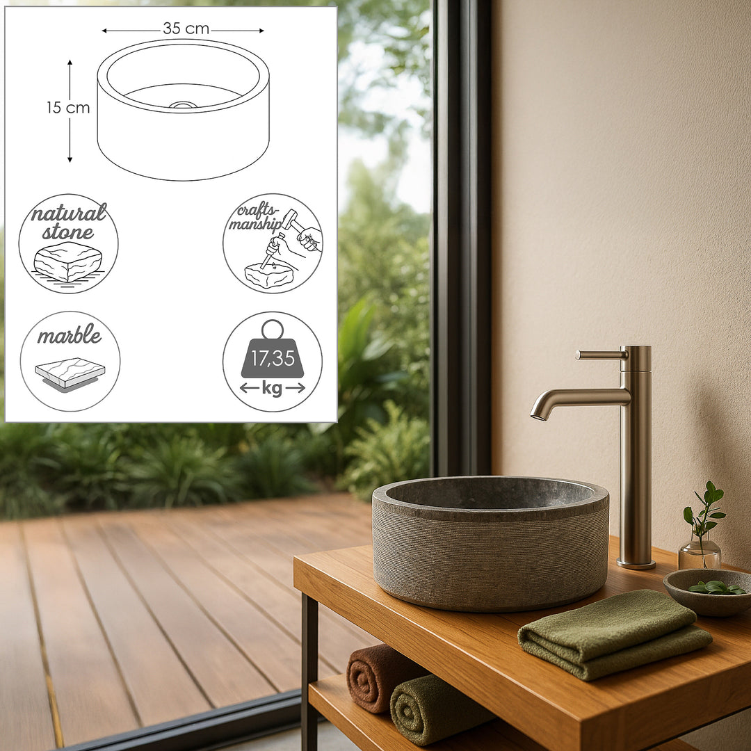 Round countertop basin made of stone with dimension sketch and material symbols, arranged on a wooden console in a calm bathroom ambience.