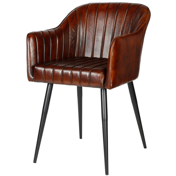 Antique brown dining chair made of genuine leather with vertical quilting, curved armrests and a sturdy black metal frame.