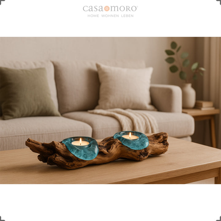 Tealight holder made of glass and burl wood on a coffee table, its warm light complements the bright, cozy living room ambience.