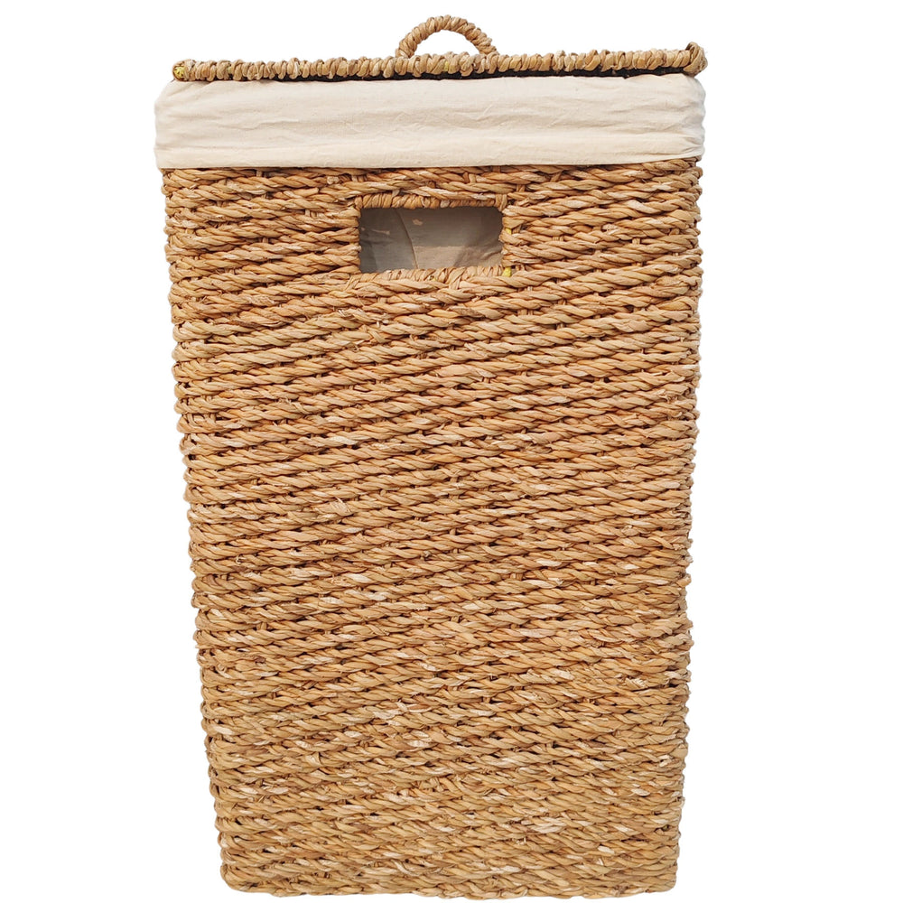 Rectangular laundry basket made of seagrass with a 90-liter capacity, a closed lid, a handle opening, and a light-colored fabric liner.