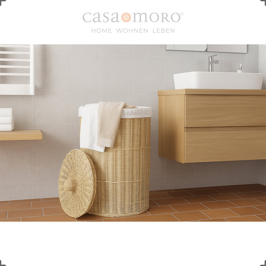 Stylish woven rattan laundry basket in modern bathroom with bright interior