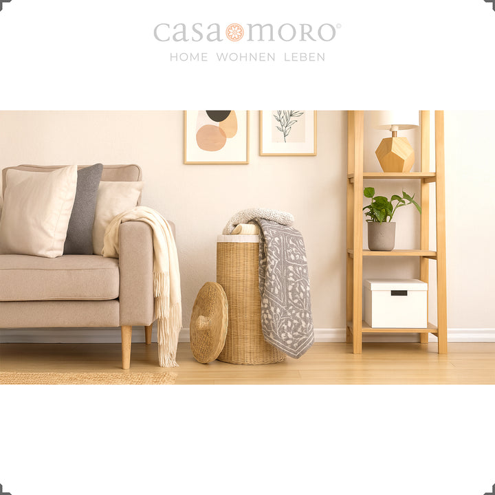Decorative rattan laundry basket in the living room, combined with home textiles and natural tones