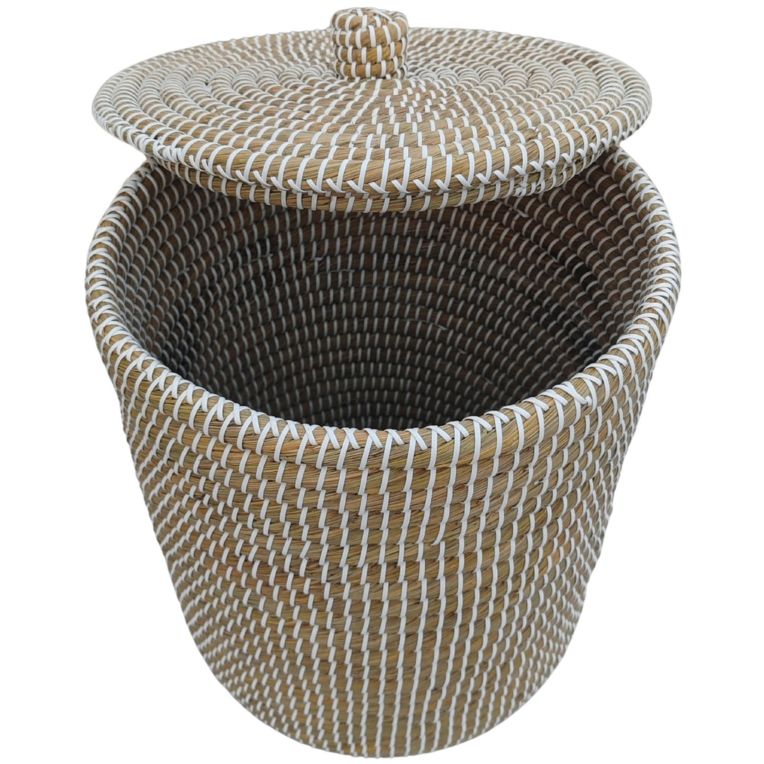 Natural/white seagrass laundry basket, approximately 40 litres, with raised lid and visible interior.