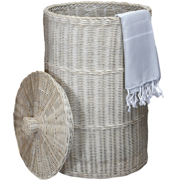 Whitewashed laundry basket with a light hammam towel, naturally braided and stylishly designed